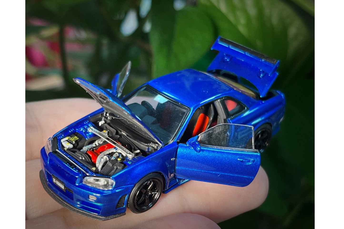PGM x One Model 1:64 Nissan Skyline GT-R (R34) Z-Tune in Bayside Blue on Standard Base