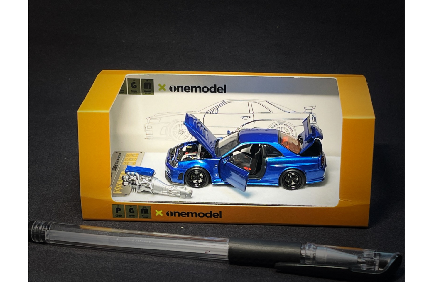 PGM x One Model 1:64 Nissan Skyline GT-R (R34) Z-Tune in Bayside Blue on Standard Base