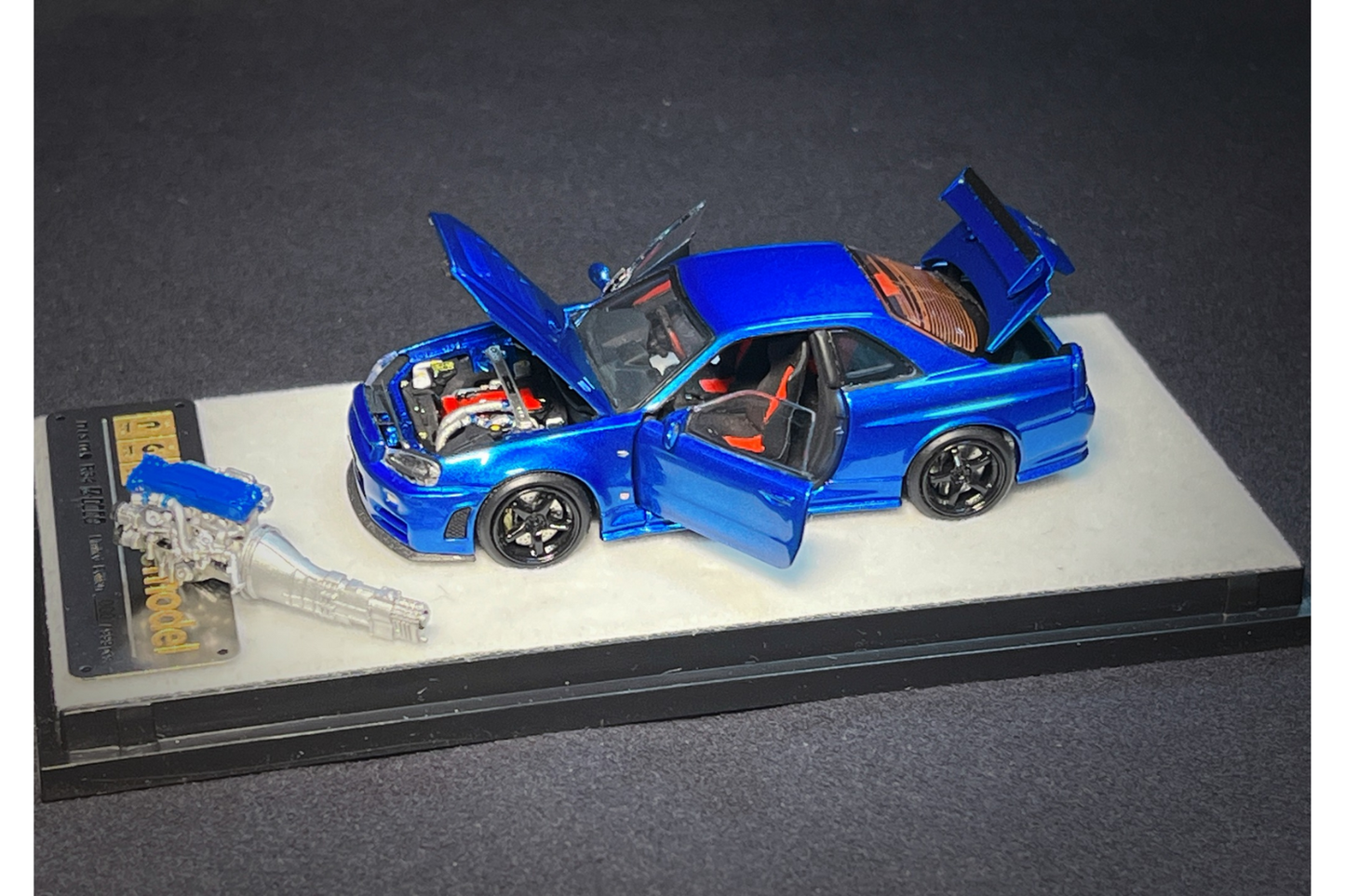 PGM x One Model 1:64 Nissan Skyline GT-R (R34) Z-Tune in Bayside Blue on Standard Base