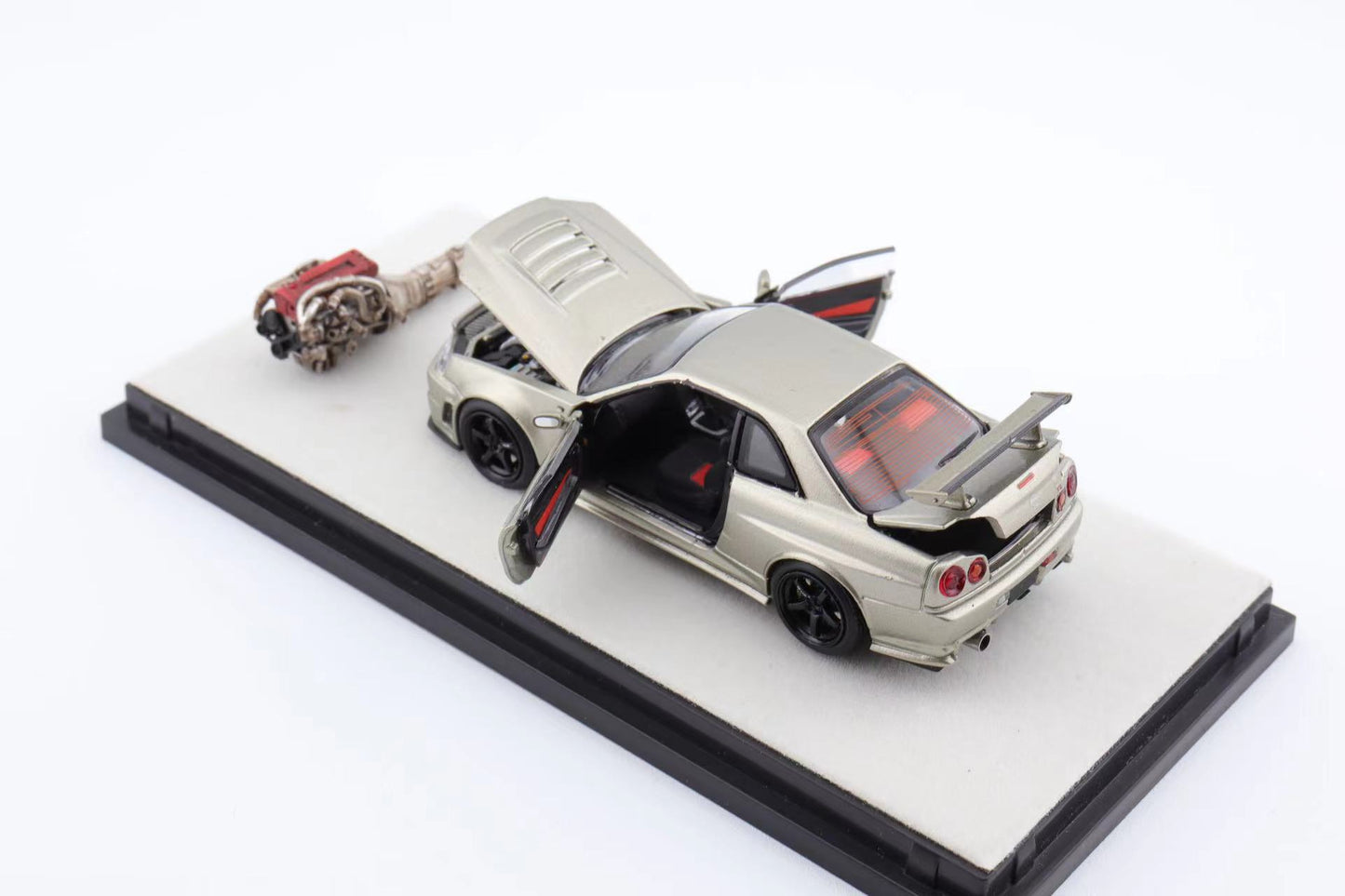 PGM x One Model 1:64 Nissan Skyline GT-R (R34) Z-Tune in Millenium Jade Green on Standard Base