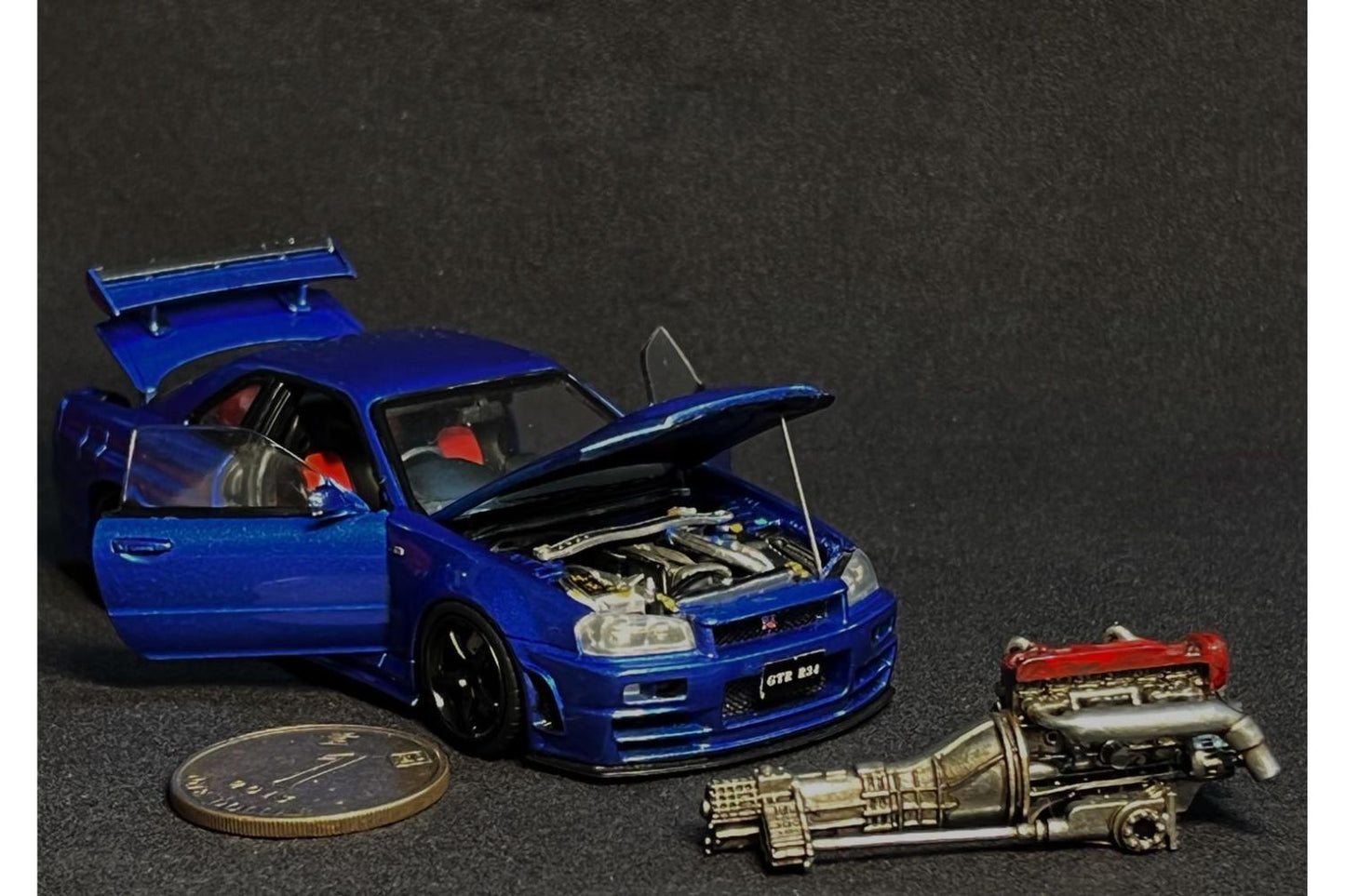 PGM x One Model 1:43 Nissan Skyline GT-R (R34) Z-Tune in Metallic Blue Ordinary Version