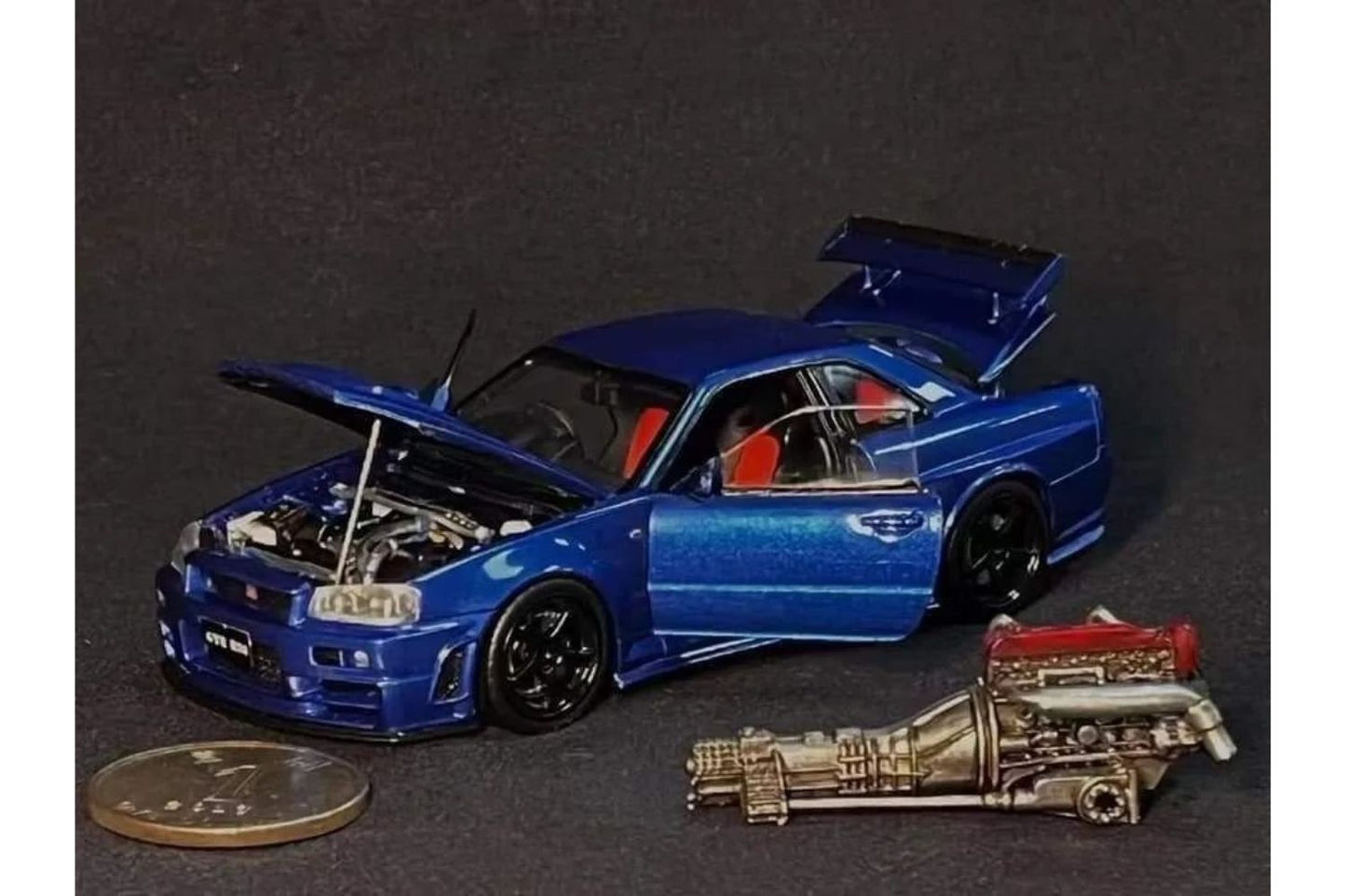 PGM x One Model 1:43 Nissan Skyline GT-R (R34) Z-Tune in Metallic Blue Ordinary Version