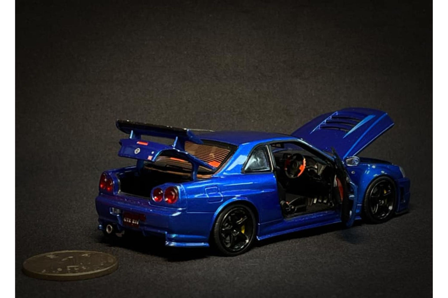 PGM x One Model 1:43 Nissan Skyline GT-R (R34) Z-Tune in Metallic Blue Ordinary Version