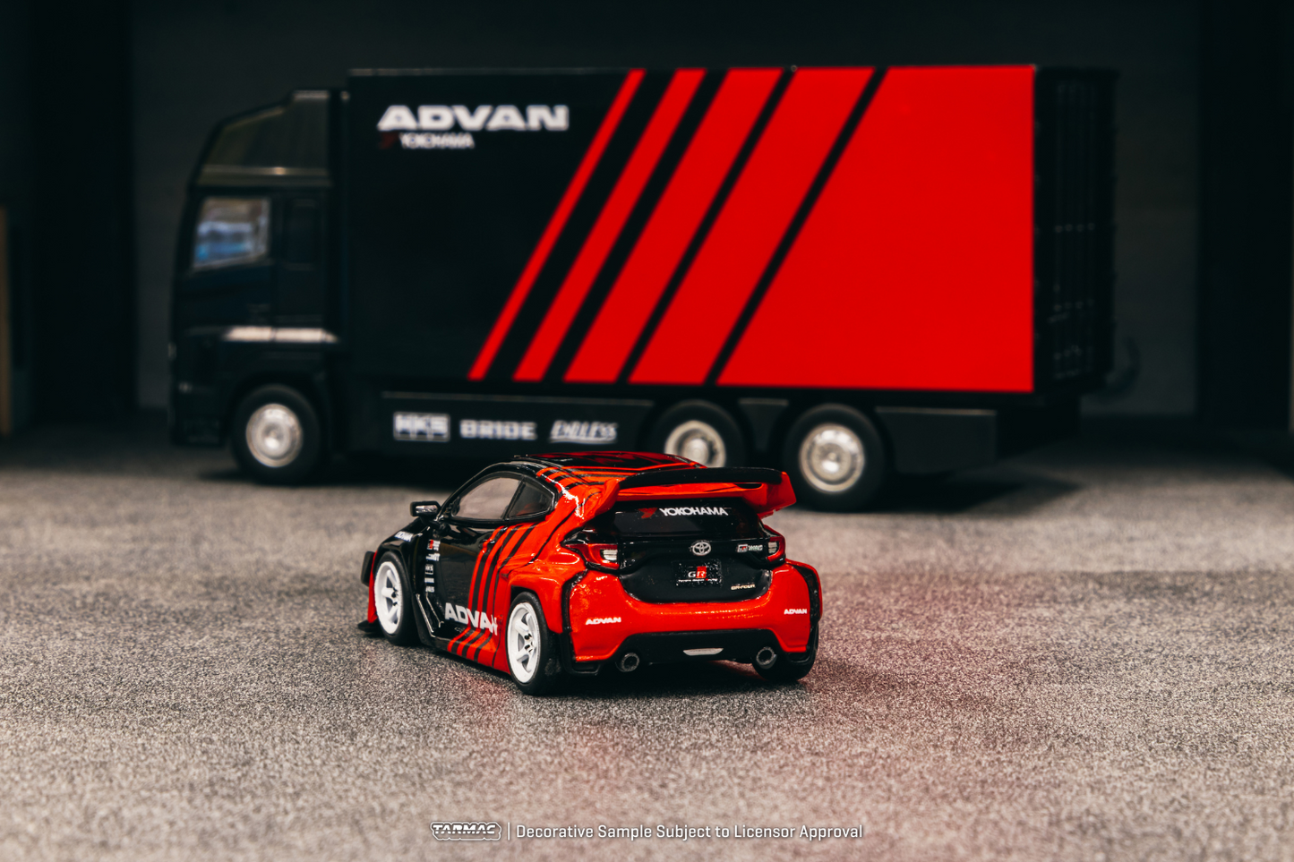 Tarmac Works 1/64 Rocket Bunny Toyota GR Yaris Pandem Wide Body in Advan Livery With Truck Packaging
