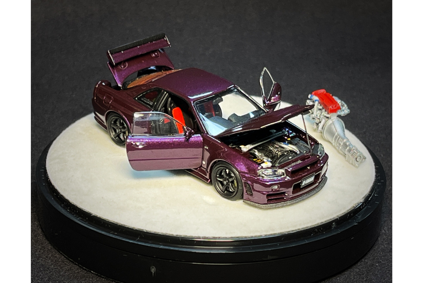 PGM x One Model 1:64 Nissan Skyline GT-R (R34) Z-Tune in Midnight Purple on Luxury Base